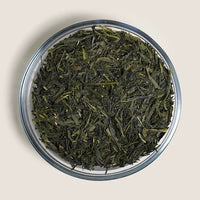 Green tea in a glass dish